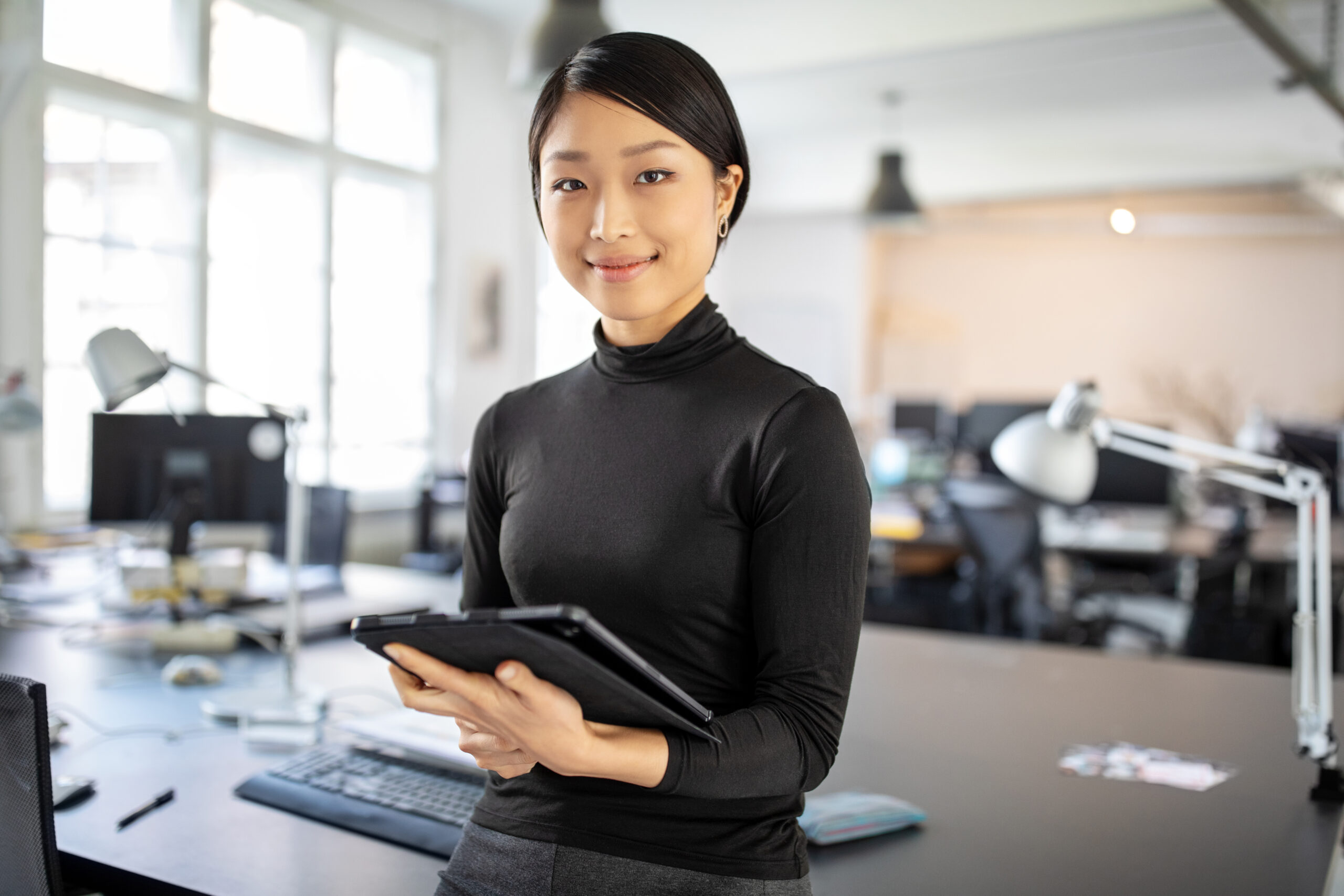 Confident asian businesswoman in office