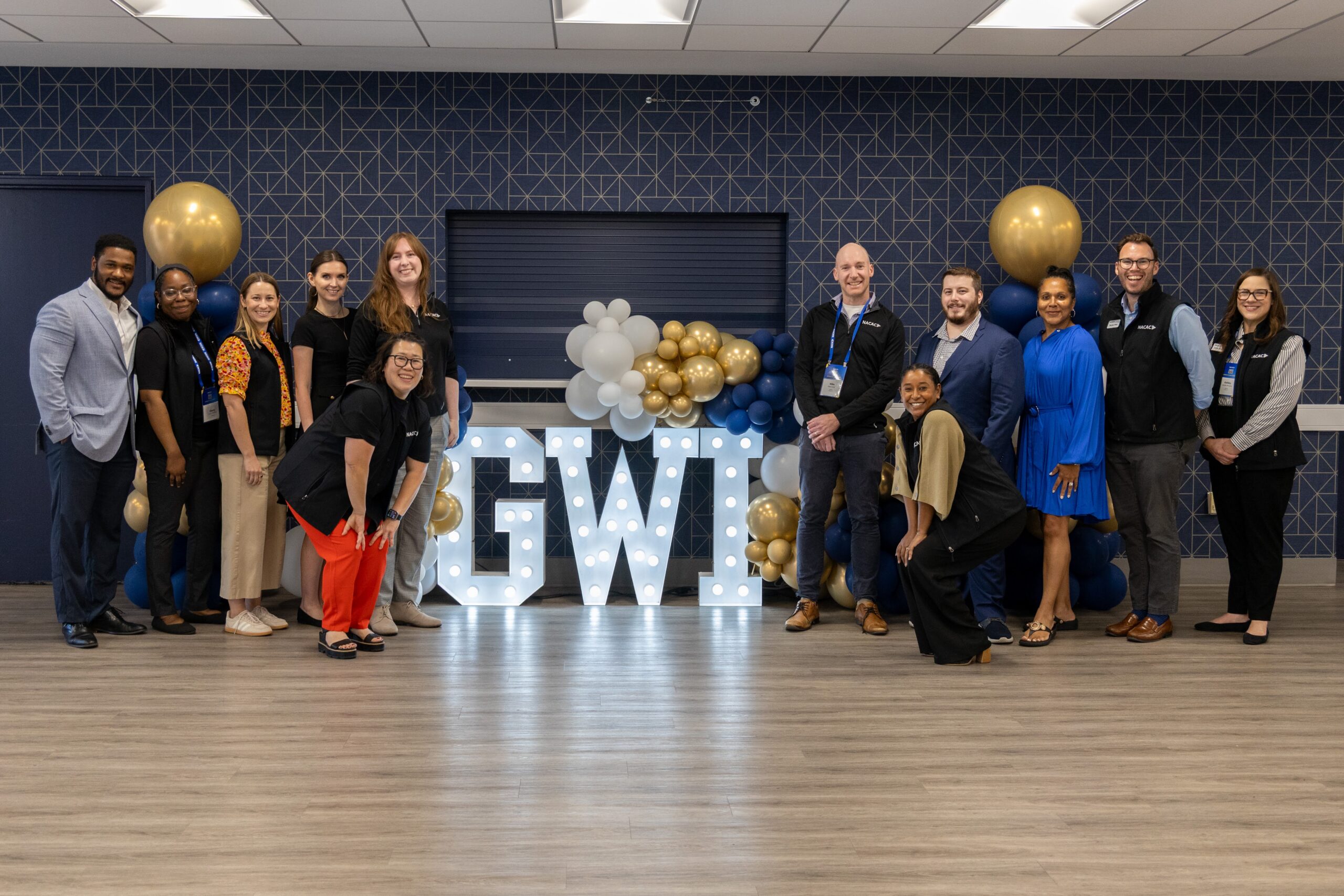 NACAC Staff in front of the GWI letters